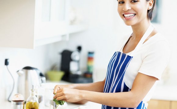 Woman in apron cooking