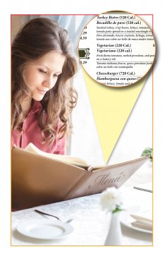 Image of a woman reading a menu with a callout of calorie labeling on the menu