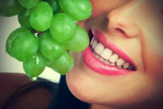 Smiling Woman and green grape