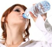 Woman Drinking Water From a Bottle