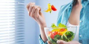 woman eating a salad