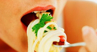 woman eating pasta