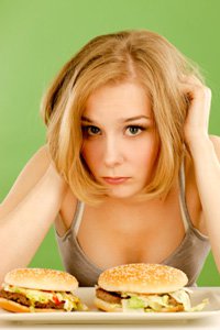 Young Woman Feels Bad About Eating Junk Food, Smaller