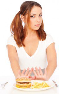 Young Woman Saying no to Junk Food