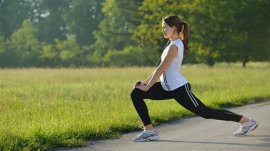 young woman stretching before Fitness and Exercise